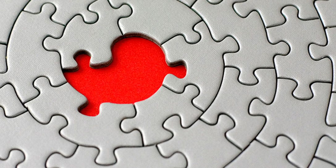 Jigsaw puzzle with a red missing piece
